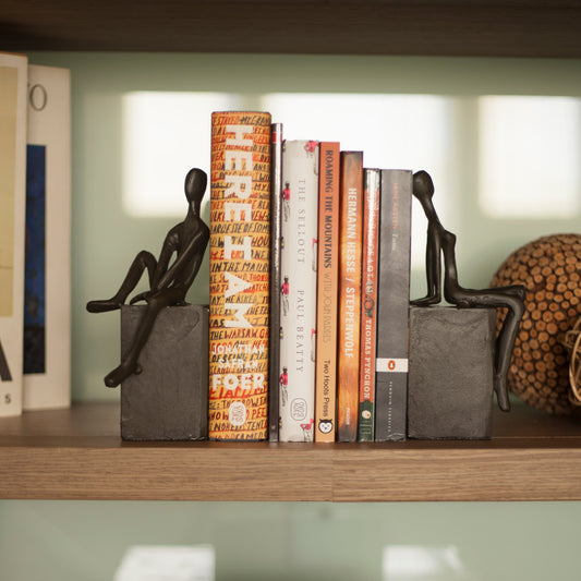 Bookend Set with Man and Woman Sitting on a Block